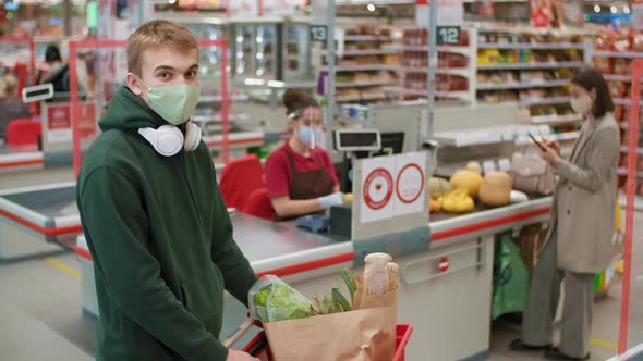 Portrait Of Boy With Shopping Cart