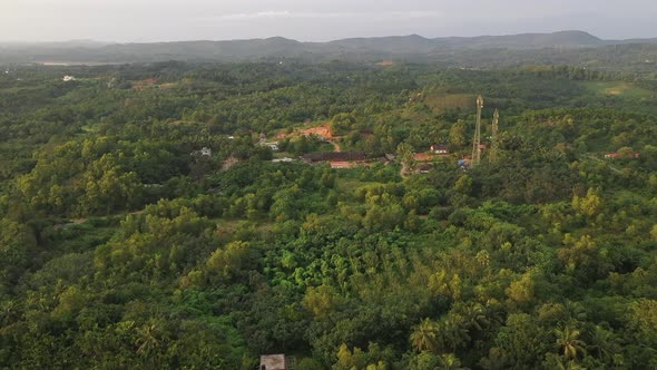 Aerial footage of Village covered in green