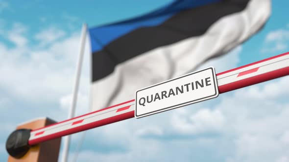 Opening Boom Barrier with QUARANTINE Sign Against the Estonian Flag alt