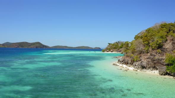 Aerial view of Bulog Dos island and turquoise water, in the sunny day, Coron, Palawan, Philippines