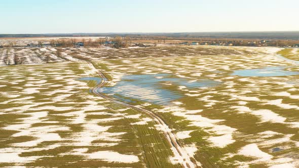 Aerial View Of Early Spring With Puddles Of Water In Fields