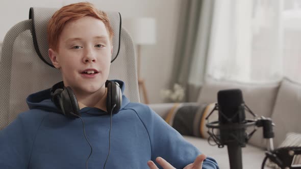 Red-haired School-aged Boy Talking on Camera