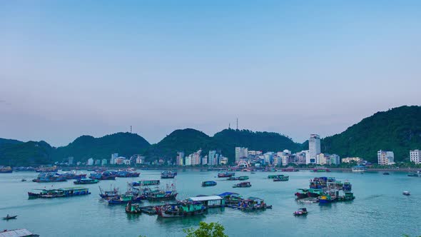 Time lapse: Vietnam Cat Ba bay at sunset with floating fishing boats on sea, cloudscape 