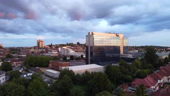 Drone shot rising up over a North London suburb at sunset, England