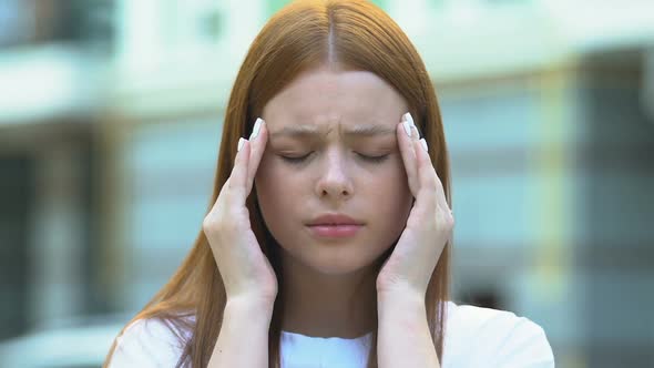 Red-Haired Young Woman Suffering Migraine Massaging Temples, Health Care, Ache