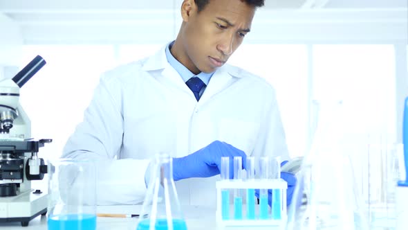 Scientist Using Smartphone in Laboratory alt