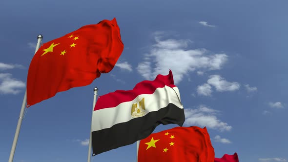 Flags of Egypt and China Against Blue Sky