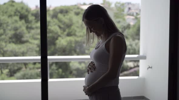 Side View of Beautiful Pregnant Woman