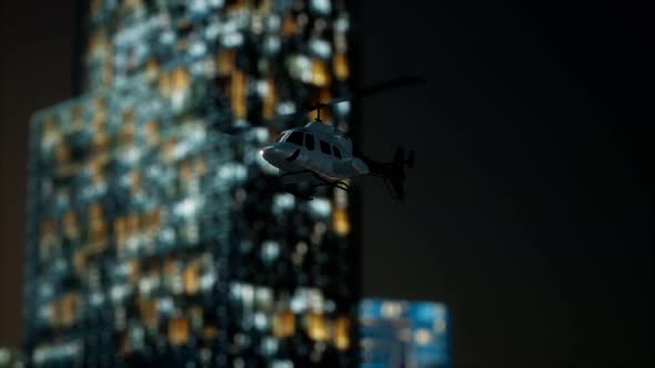 Slow Motion Helicopter Near Skyscrapers at Night