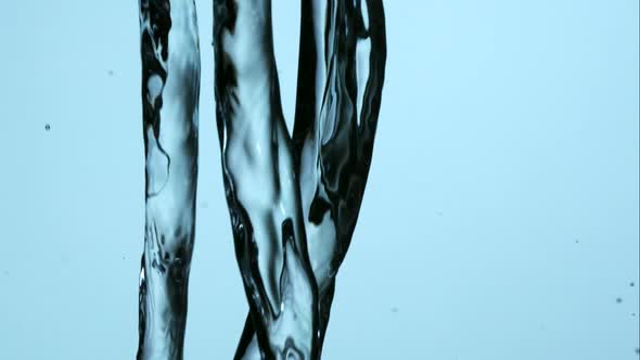 Water pouring and splashing in ultra slow motion 1500fps on a reflective surface - WATER POURS 