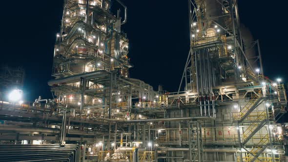 Oil Refinery with Electric Lighting Filmed at Night