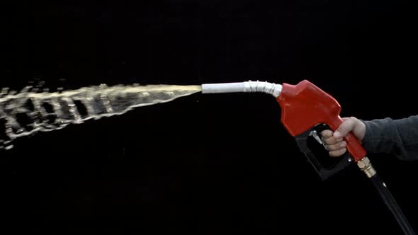 Gas nozzle spraying on black background, slow motion