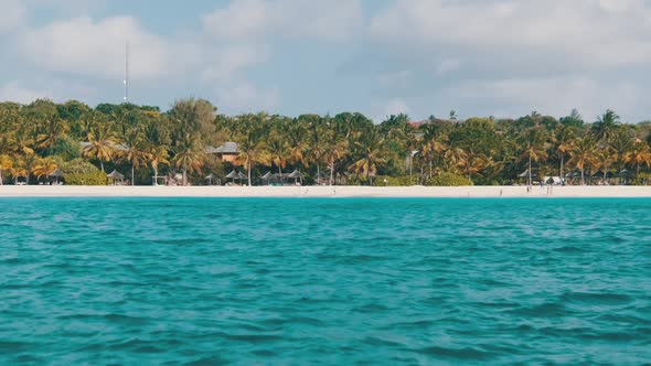 View From Boat to the Coast of Zanzibar with Paradise Beach Palms and Hotels