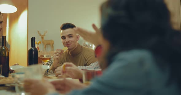 Young Handsome Guy Resting in the Company of Friends