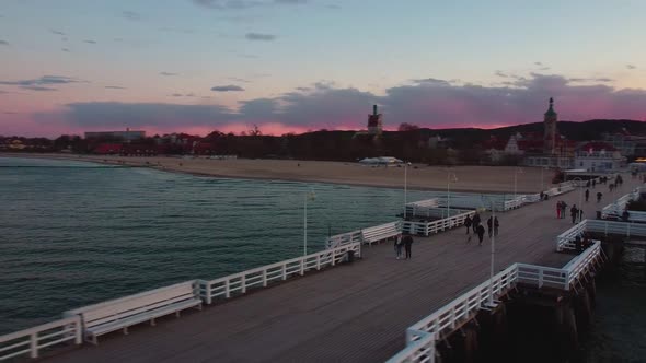 Cinematic pier in the sunset from a bird's eye view. Filming at sunset in Sopot.