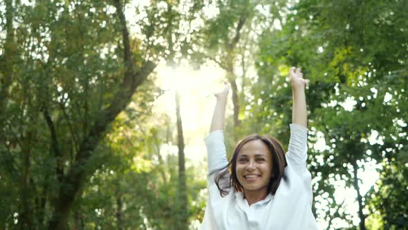 Close Up Portrait of Young Brunette Girl Smiling and Dancing in Slow Motion. Happy Awesome Woman