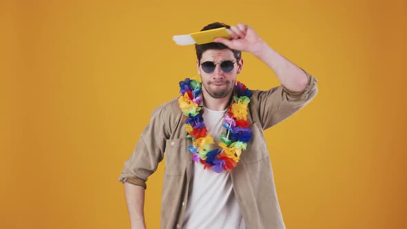 Young Man in Sunglasses and Hawaiian Lei