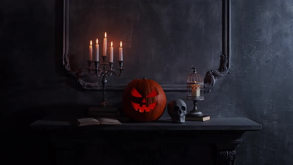 Scary laughing pumpkin and an old skull over the frightening gothic background.