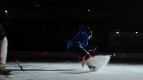 Professional Hockey Forward Technically Beats the Defender and Quickly Goes To the Hockey Goal