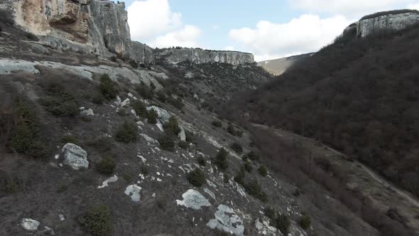 Aerial flight over beautiful rock cliff