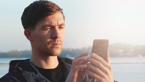 Young Man Trying To Catch a Cellular Signal