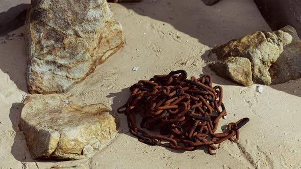 Old Rusted Chain in the Sand
