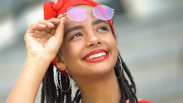 Pretty Black Teen Girl Looking at Sky Through Sun Glasses, Enjoying Nature View