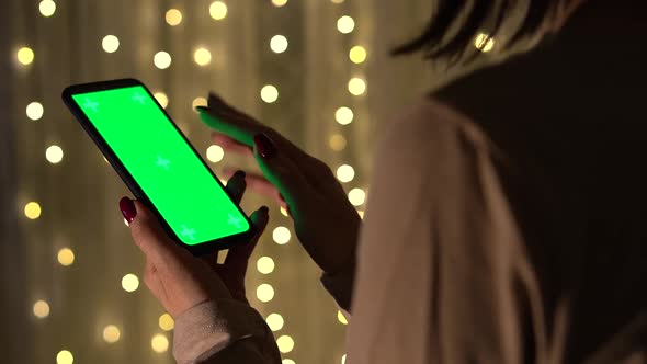 Woman Holding Chroma Key Green Screen Smartphone