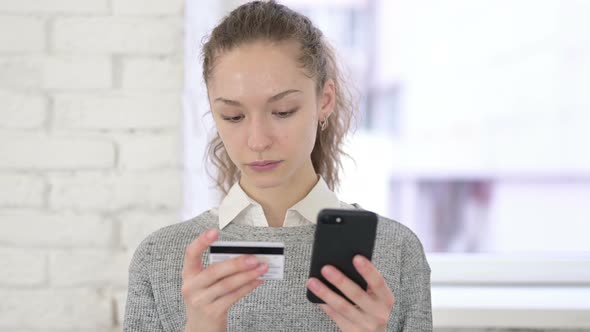 Portrait of Latin Woman Facing Online Payment Failure on Smartphone