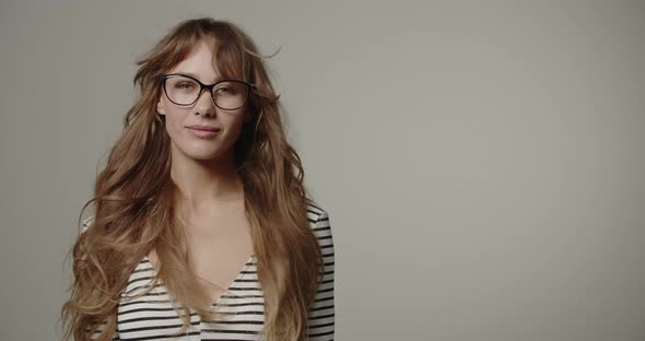 Beautiful Young Woman With Windswept Long Hair