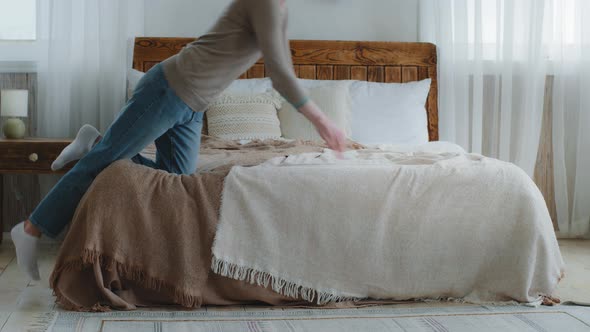 Exhausted Bored Young Woman Falling Down on Bed in Bedroom