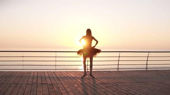 Young Tender Ballet Dancer Practicing Near the Sea Ocean