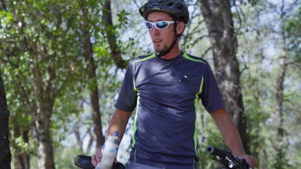 Mountain biker takes a water break