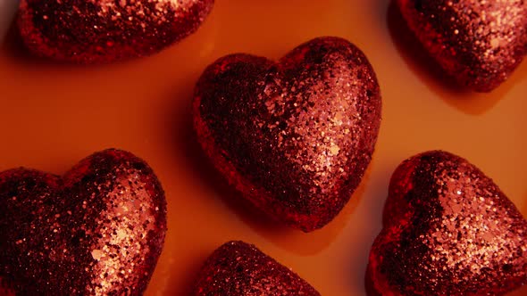 Rotating stock footage shot of Valentines decorations and candies - VALENTINES 0034