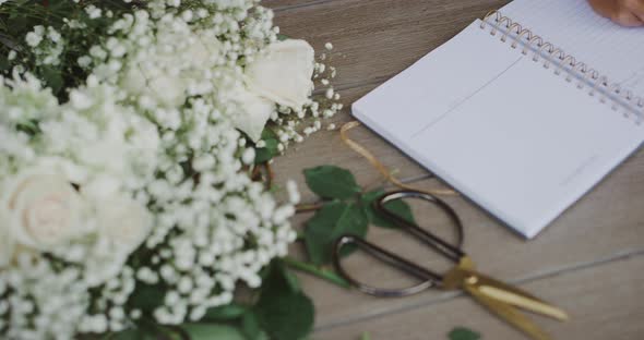 Professional florist planning her day alt