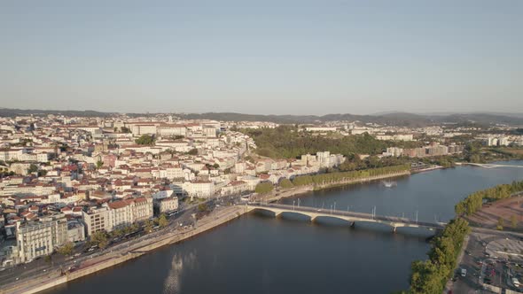 Mondego River and Santa Clara bridge with Coimbra University town in background, Portugal.