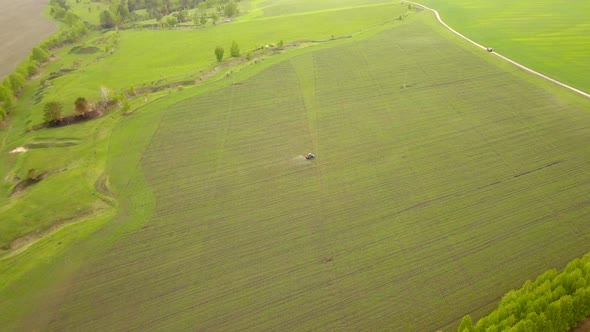 Tractor On The Green Field