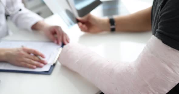 Man with Plaster Cast of His Forearm and Hand in Rehabilitation Center