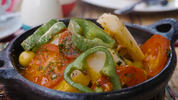 Traditional Tajine Dishes, Tagine Couscous on Rustic Wooden Table. Tagine Lamb Meat and Vegetables