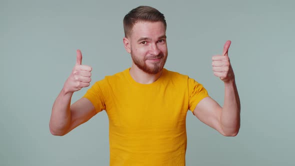 Bearded Man Raises Thumbs Up Agrees or Gives Positive Reply Recommends Advertisement Likes Good