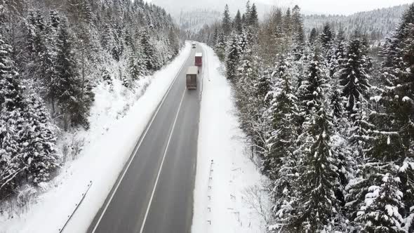 Top View of a Mountain Road in Winter on Which Cars Drive