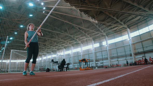 Pole Vaulting - the Sportswoman Is Configuring To Jump and Running