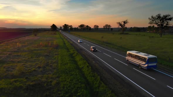 Aerial Drone View Cars Bus and White Semi Truck Driving By Road