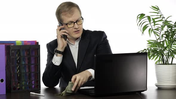 Businessman Manager Holding Bunch of Money Paper Banknotes Making Telephone Call