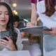 Asian female customer order food drink from smartphone digital menu - VideoHive Item for Sale