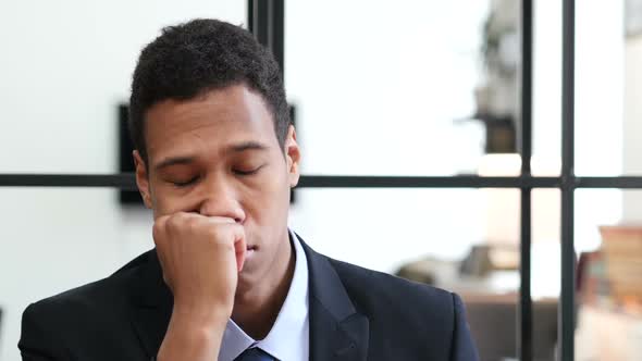 Black Businessman Sleeping at Work