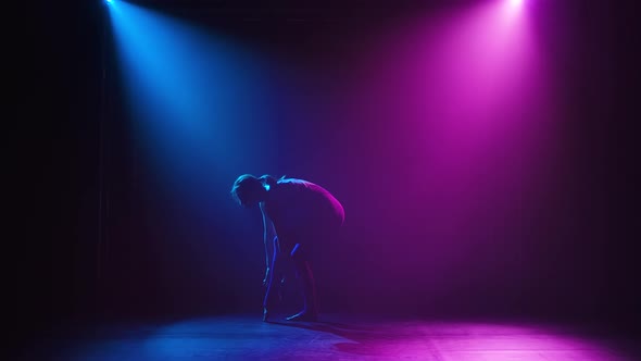 Rhythmic Gymnast Performs Sporting Exercise, Stretch, Flexibility, Aerobics. Black Background with