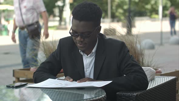 Afro American Businessman During Work Break Take an Order in Restaurant