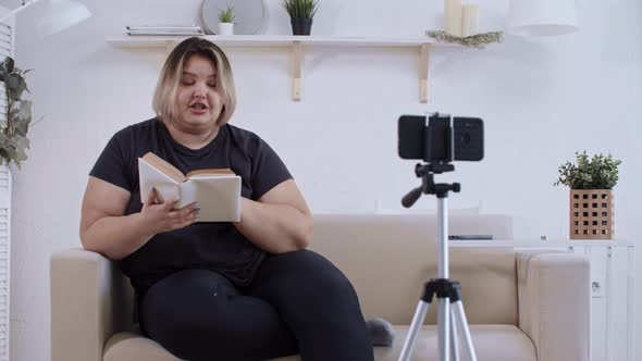 Body Positivity Confident Fat Woman Feminist Lying on a Couch and Making a Video on Her Phone for