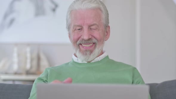 Close Up of Old Man Doing Video Chat on Laptop